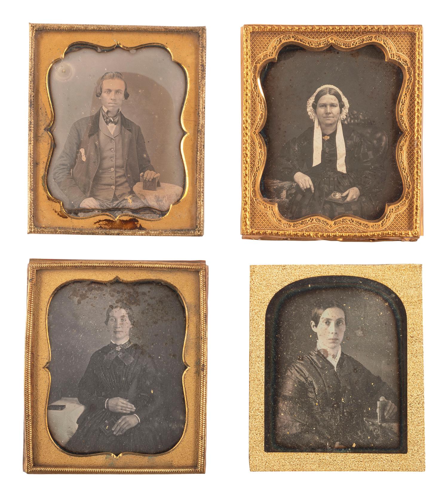 [EARLY PHOTOGRAPHY]. A group of 23 daguerreotypes featuring subjects posed with cased images, including: