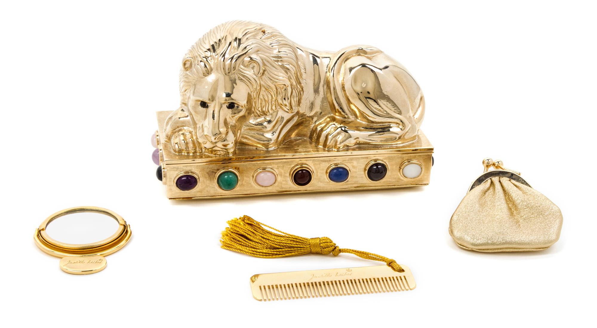 A Judith Leiber Goldtone Lion Minaudiere, 5 1/2 x 3 x 2 1/2 inches.