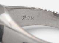 A 20K White Gold, Star Sapphire, and Diamond Ring