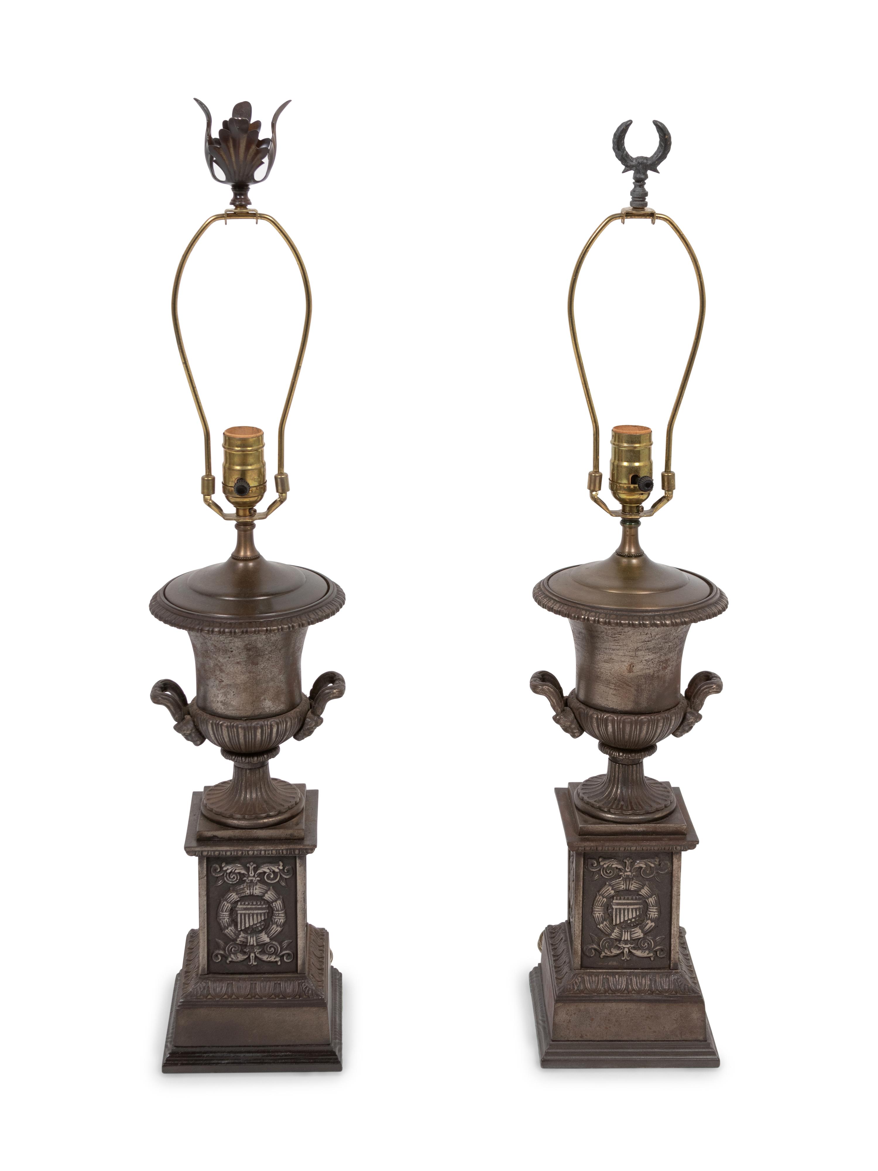 A Pair of Cast Iron Urns Mounted as Lamps