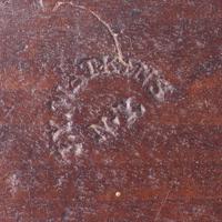 A carved mahogany cake board Stamped J. Conger and J.Y. Watkins, New York