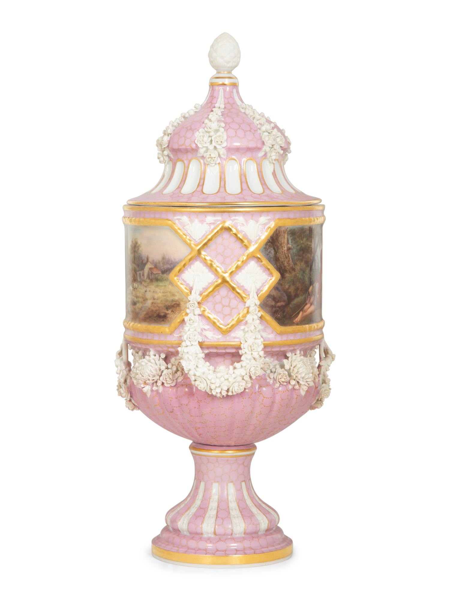 A Sèvres Style Painted Porcelain Lidded Urn with Bisque Floral Swags