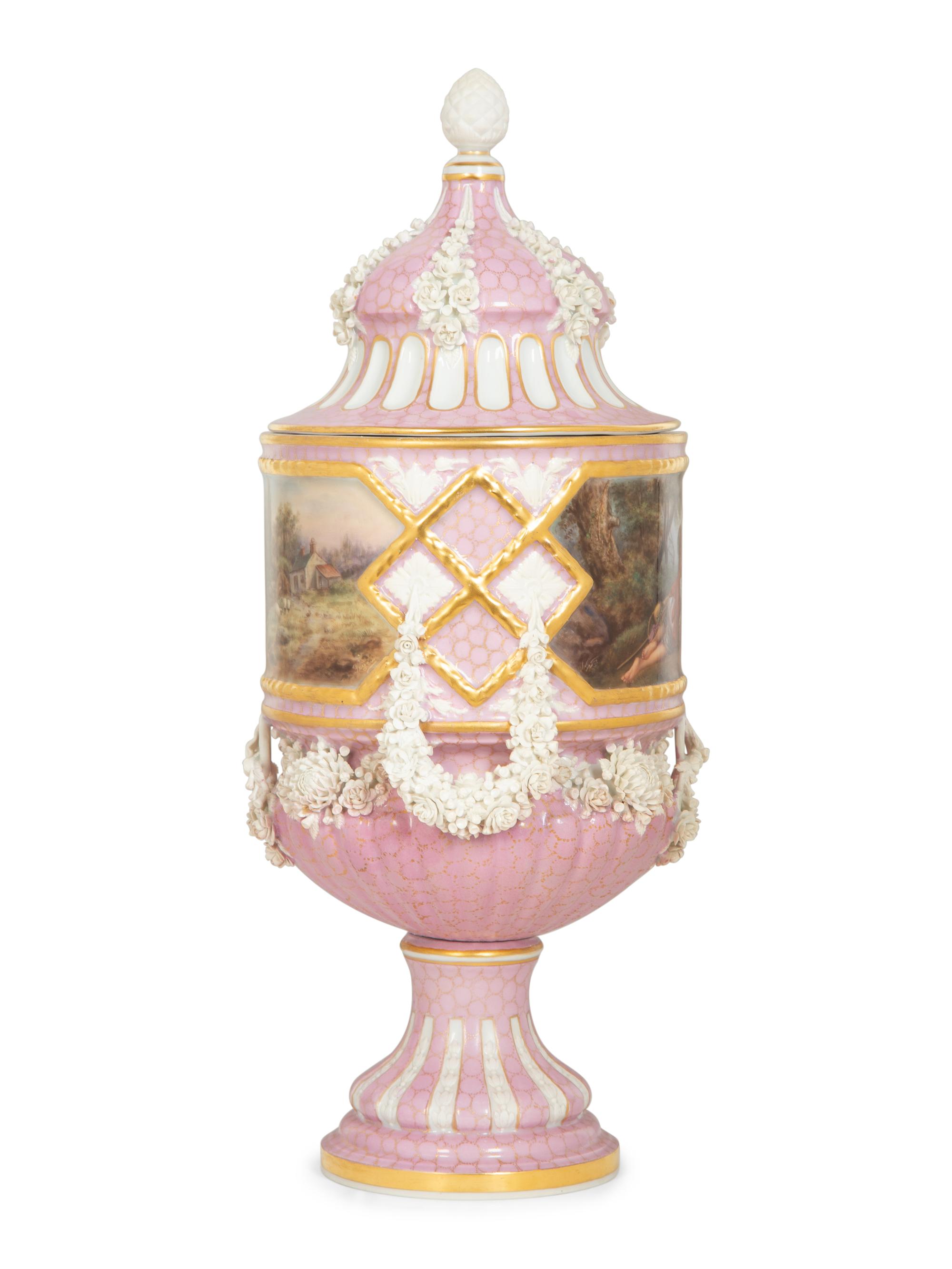 A Sèvres Style Painted Porcelain Lidded Urn with Bisque Floral Swags