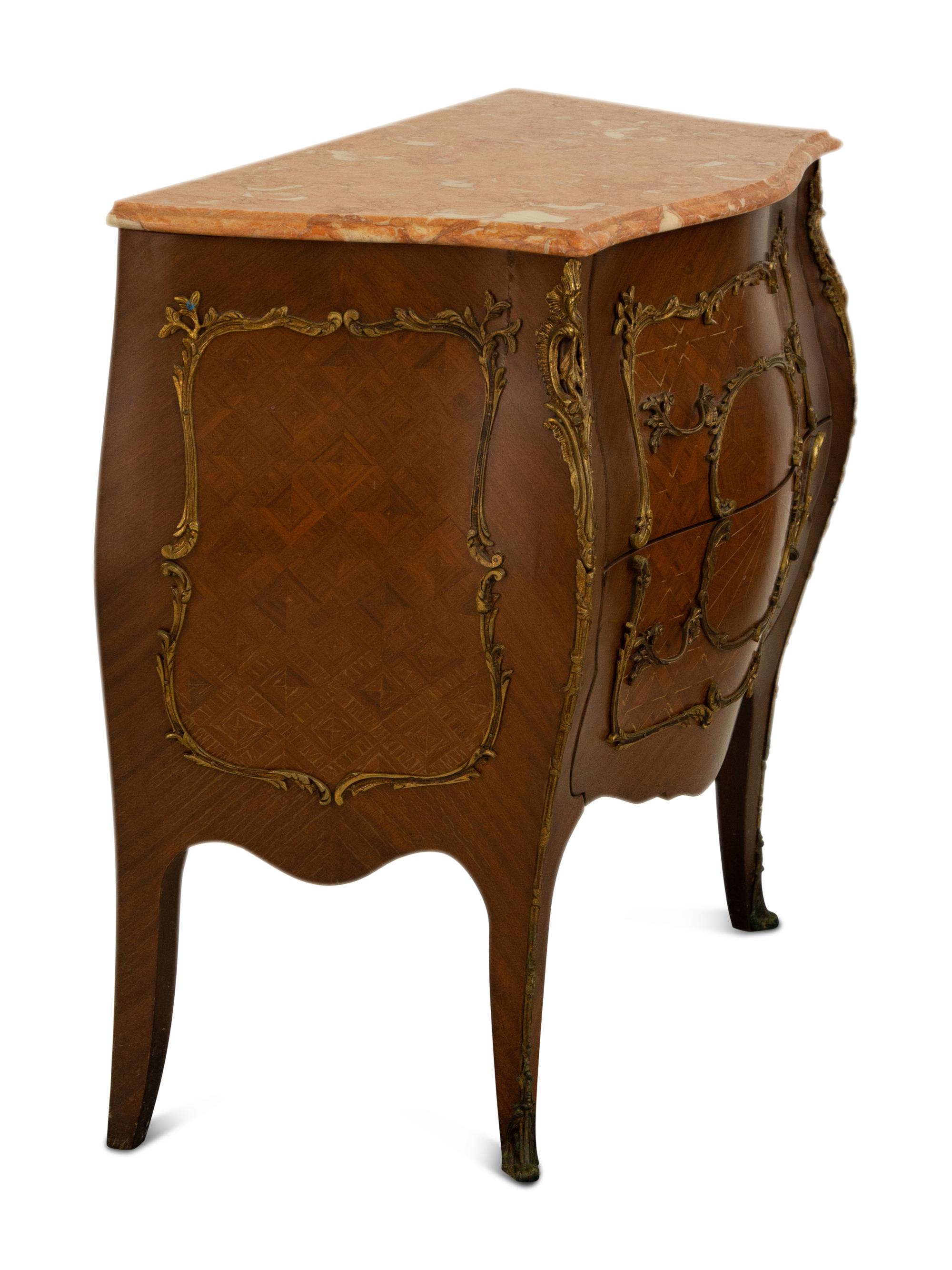A Louis XV Style Gilt Bronze Mounted Marble Top Bombe Commode