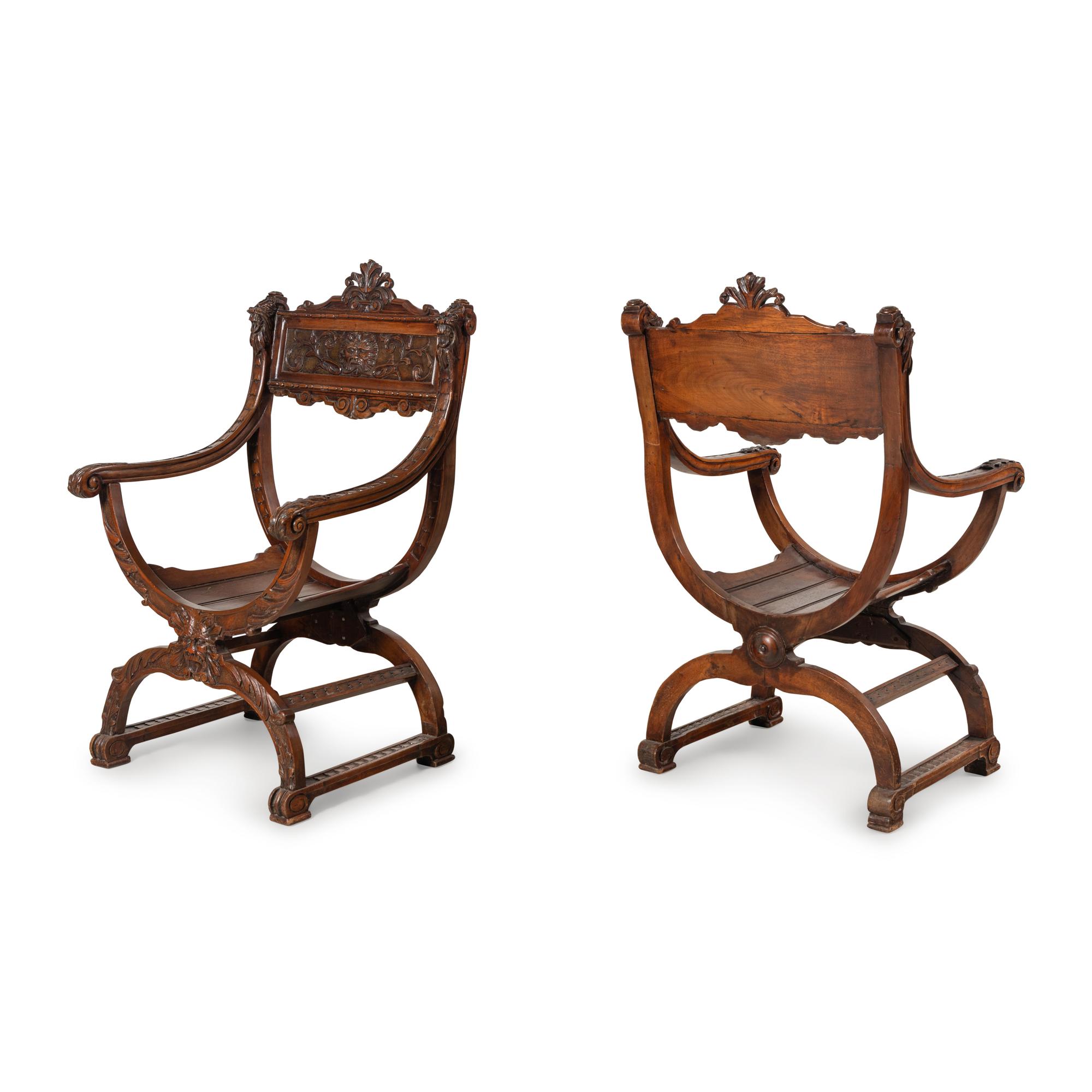 A Pair of Italian Carved Walnut Savonarola Chairs