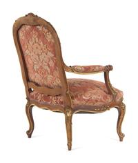A Louis XV Style Carved and Parcel Gilt Walnut Fauteuil