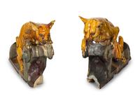 A Pair of Continental Glazed Terra Cotta Fox Roof Ornaments
