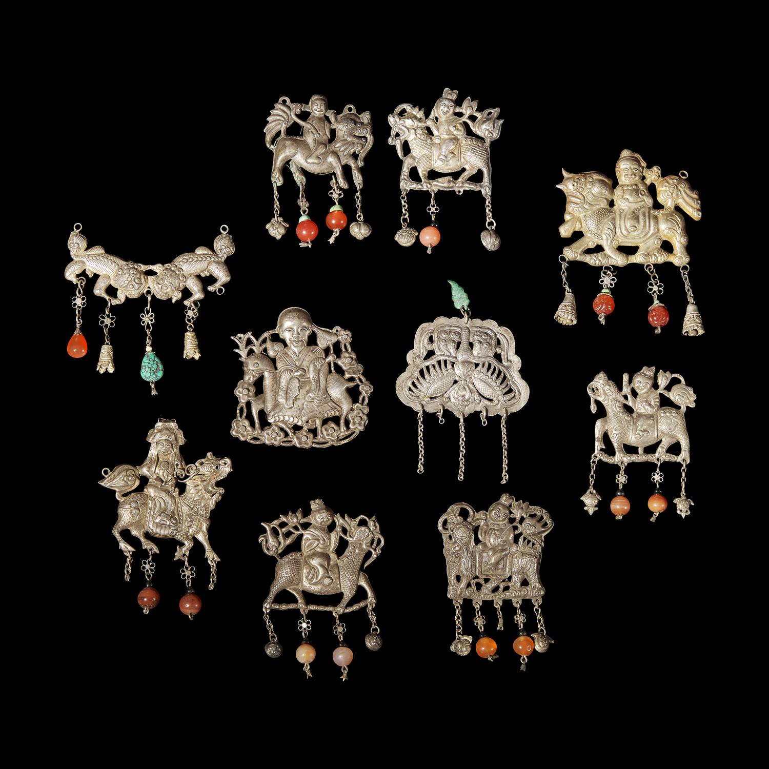 A Group of 10 Assorted Chinese Silver 'Boy and Qilin' Pendants, Late Qing Dynasty-Republic Period 晚清-民國 銀麒麟送子墜瑪瑙長命鎖及其他一組十件