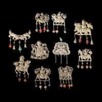 A Group of 10 Assorted Chinese Silver 'Boy and Qilin' Pendants, Late Qing Dynasty-Republic Period 晚清-民國 銀麒麟送子墜瑪瑙長命鎖及其他一組十件