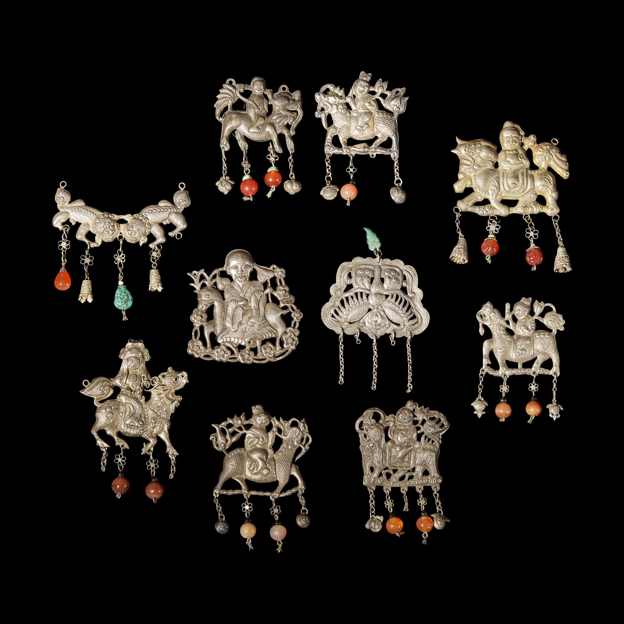A Group of 10 Assorted Chinese Silver 'Boy and Qilin' Pendants, Late Qing Dynasty-Republic Period 晚清-民國 銀麒麟送子墜瑪瑙長命鎖及其他一組十件
