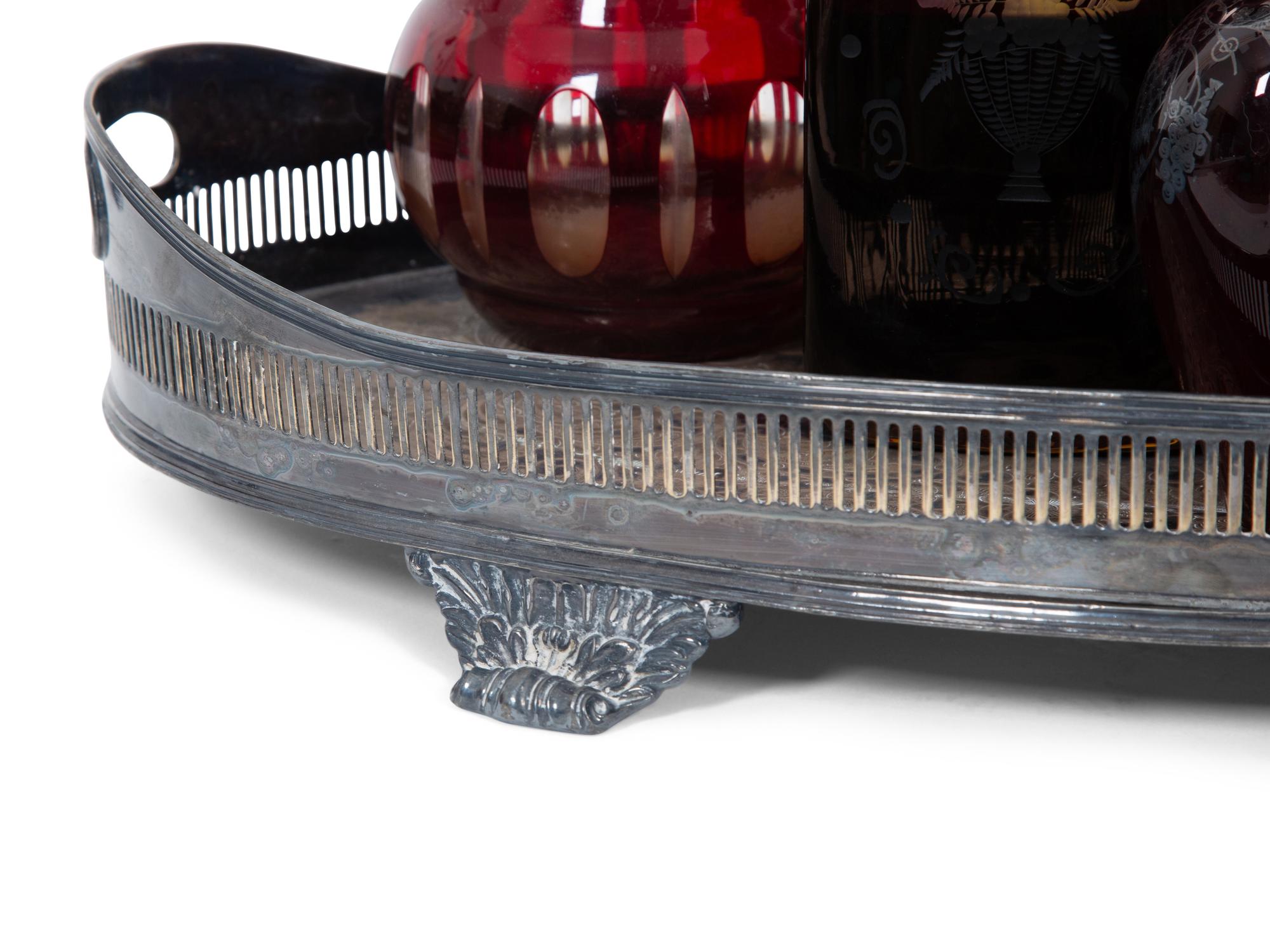 Eight Colored Glass Decanters and a Silver-Plate Galleried Serving Tray