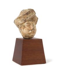 A Gandharan Stucco Head of a Male Height 2 3/8 inches.