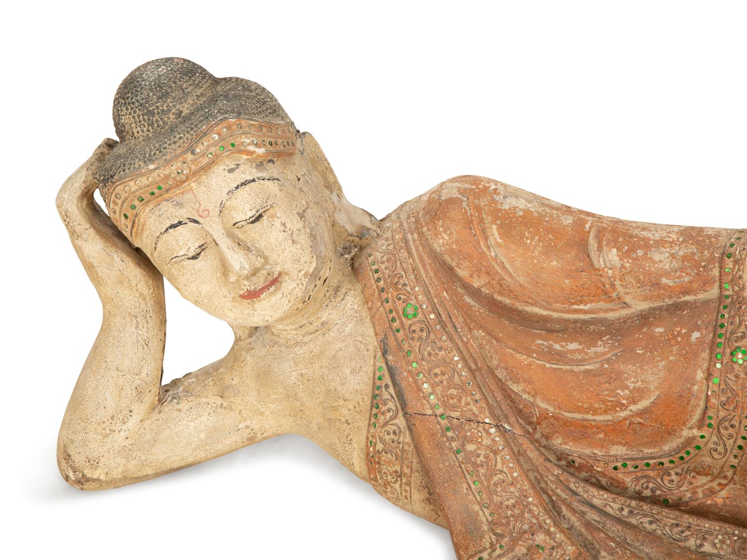 A South-East Asian Carved and Painted Wood Sculpture of a Reclining Buddha — 19th/20th Century
