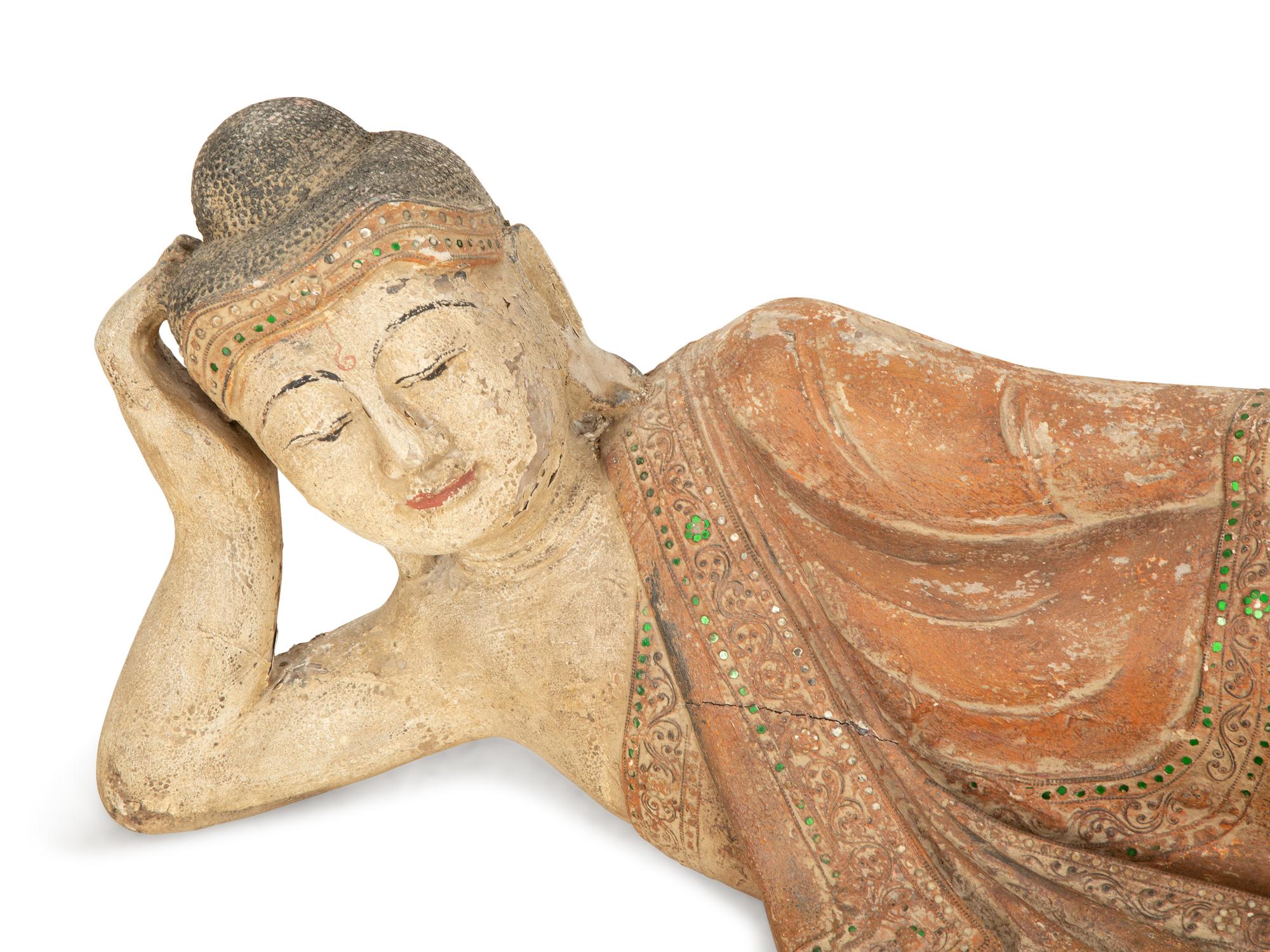 A South-East Asian Carved and Painted Wood Sculpture of a Reclining Buddha — 19th/20th Century