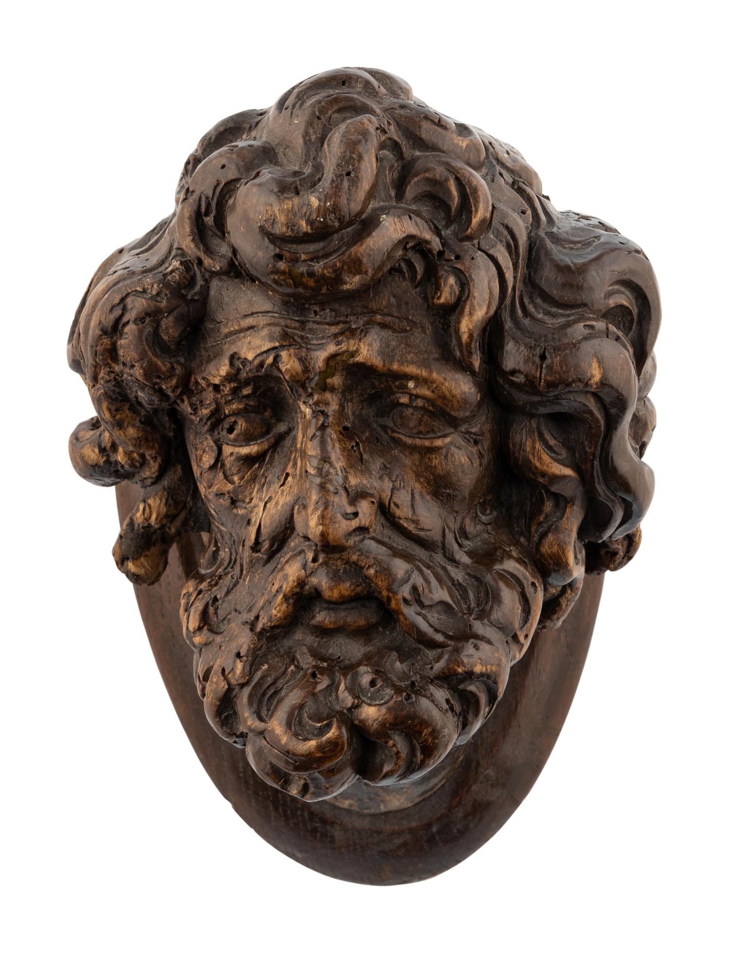 A Continental Carved Oak Head of a Saint