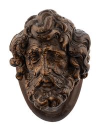 A Continental Carved Oak Head of a Saint