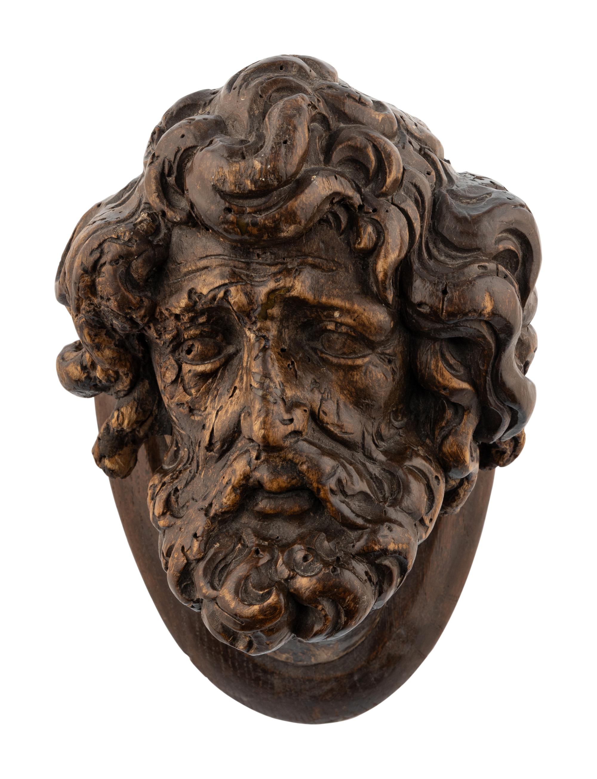 A Continental Carved Oak Head of a Saint