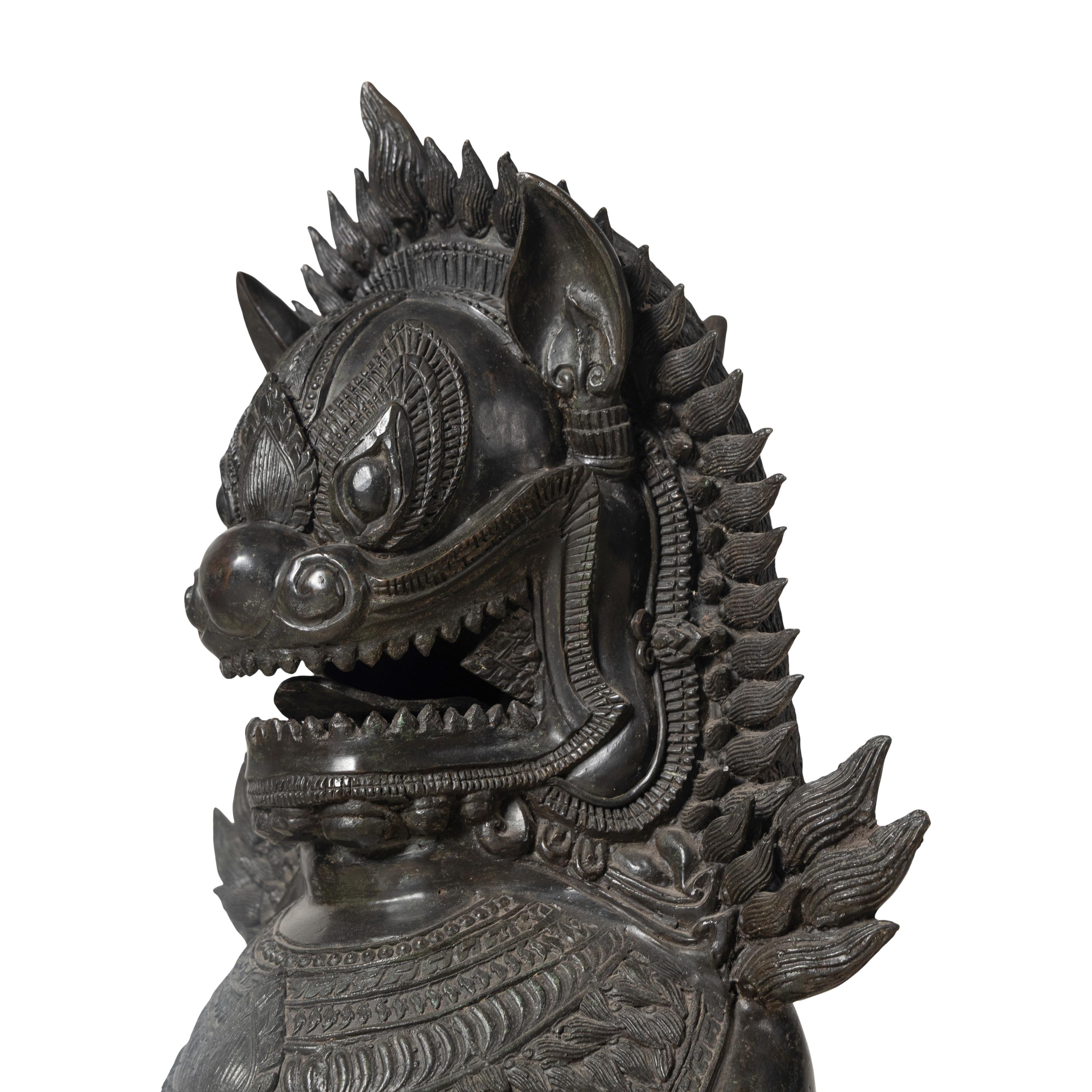 A Pair of Patinated Bronze Guardian Lions