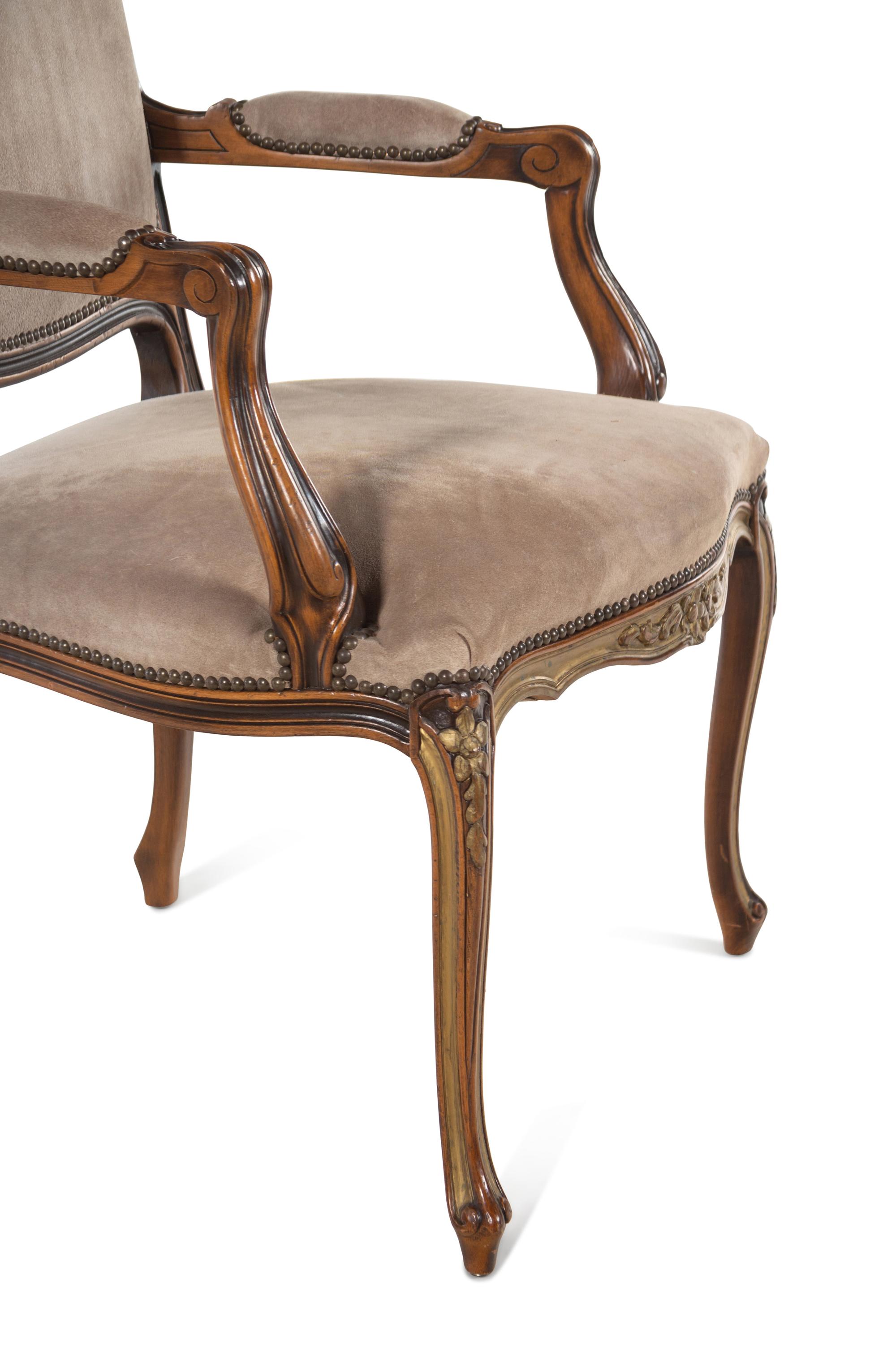 A Pair of Continental Parcel Gilt Armchairs with Suede Upholstery
