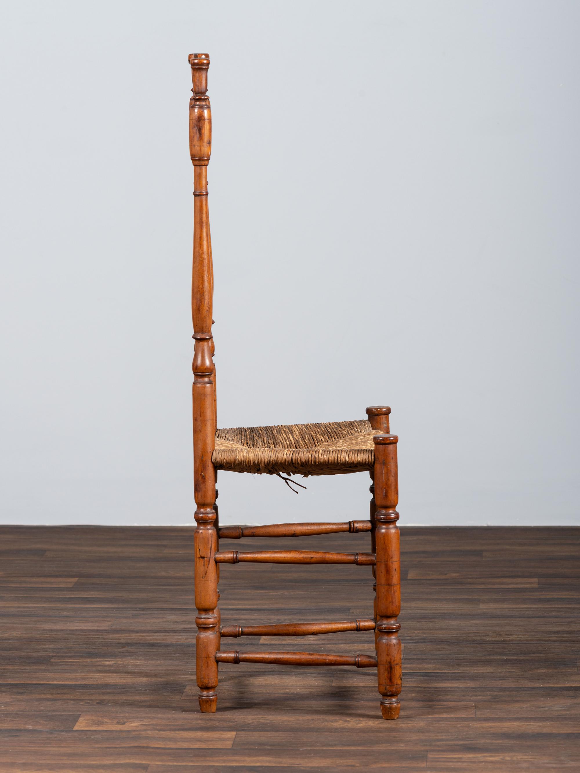 A William and Mary Style Turned and Pierced Carved Banister-Back Rush Seat Side Chair