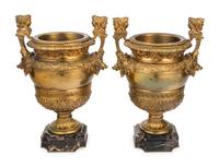 A Pair of Neoclassical Gilt Bronze Urns on Marble Plinths