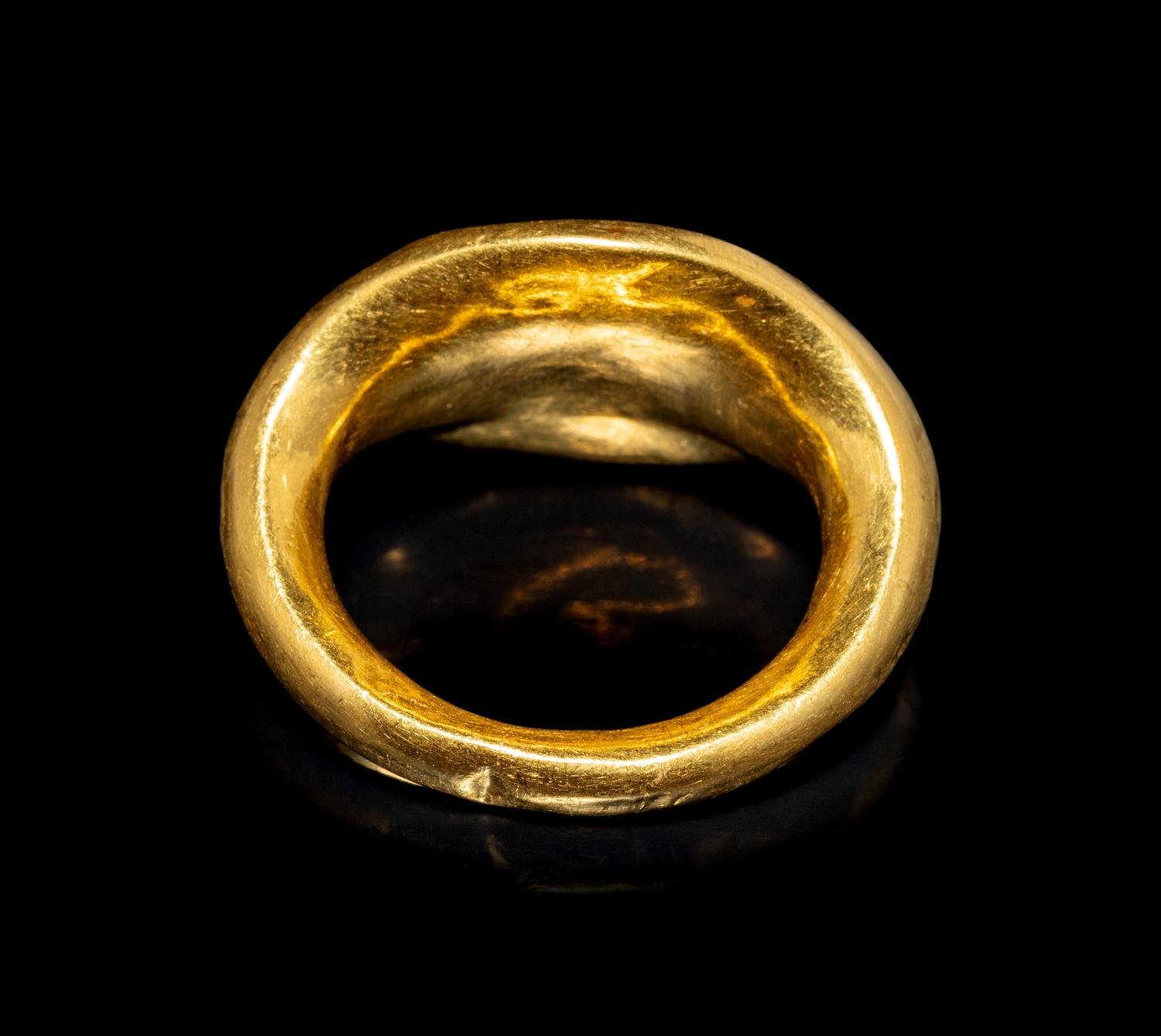 A Roman Gold and Nicolo Finger Ring with a Bust of a Youth