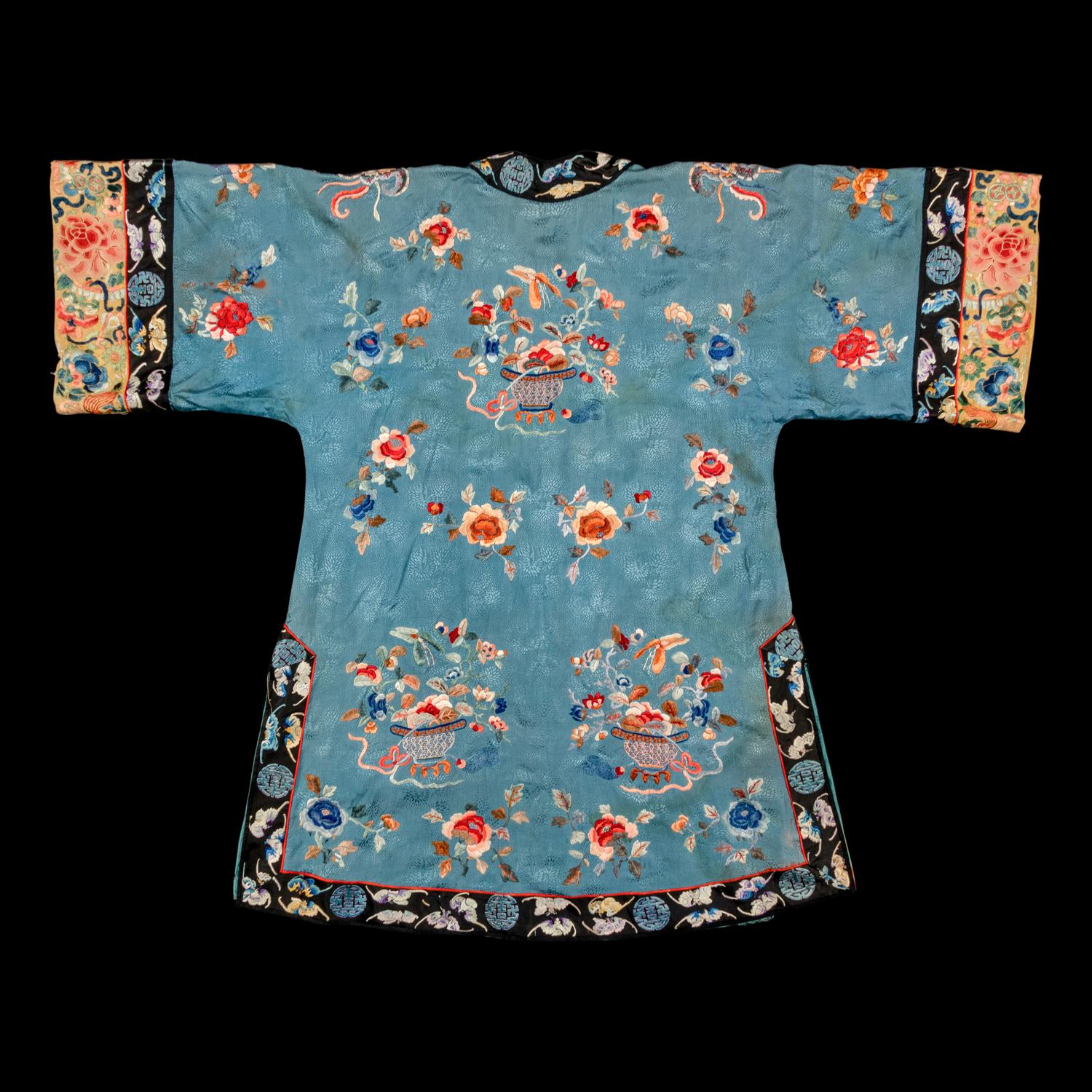 A Chinese Celeste Blue Ground Embroidered Silk Lady's Jacket 清晚期 藍地牡丹花籃紋褂