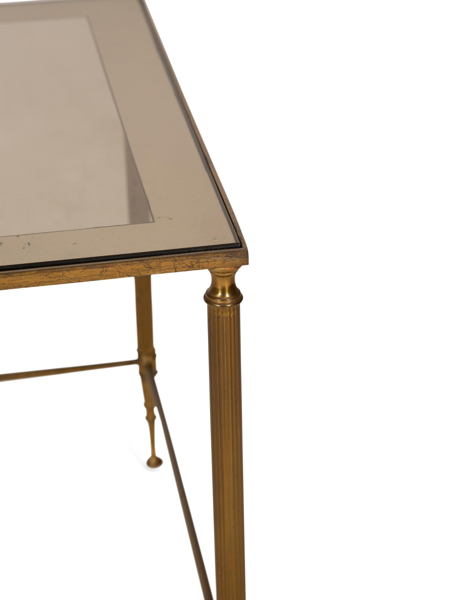 A Set of Three Gilt Metal Nesting Tables in the Style of Maison Jansen