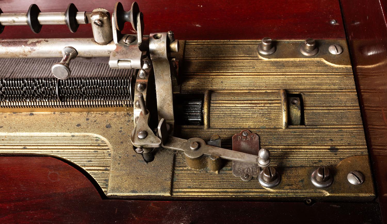 A Mira Mahogany-Cased Disc Music Box and Cabinet