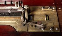 A Mira Mahogany-Cased Disc Music Box and Cabinet