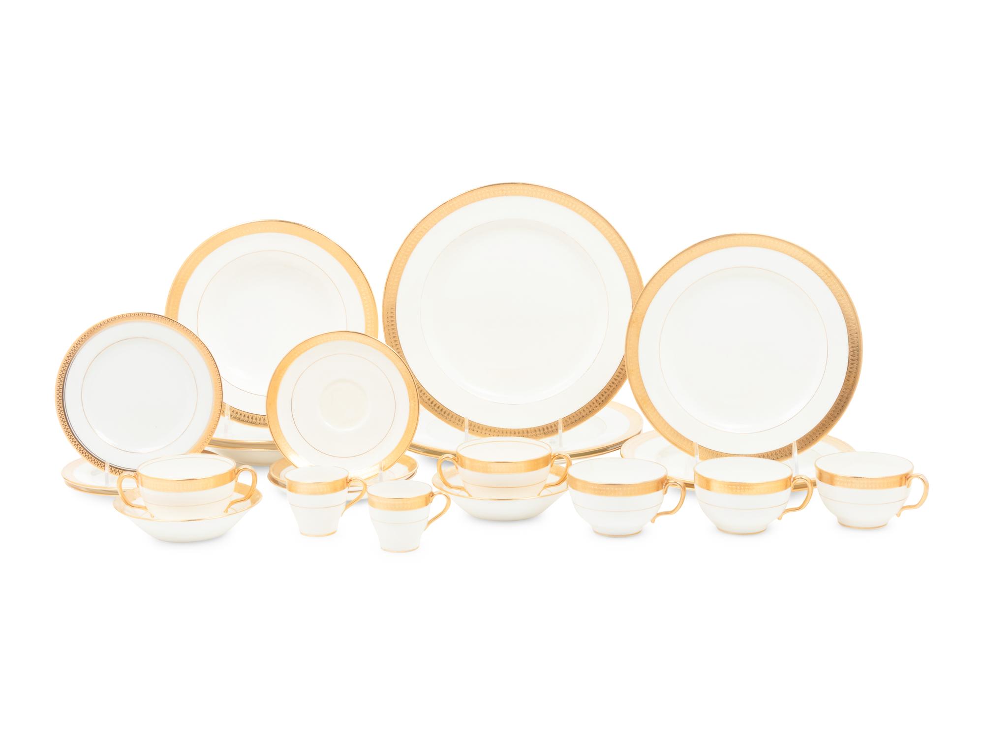 A Mintons Parcel Gilt Porcelain Dinner Service