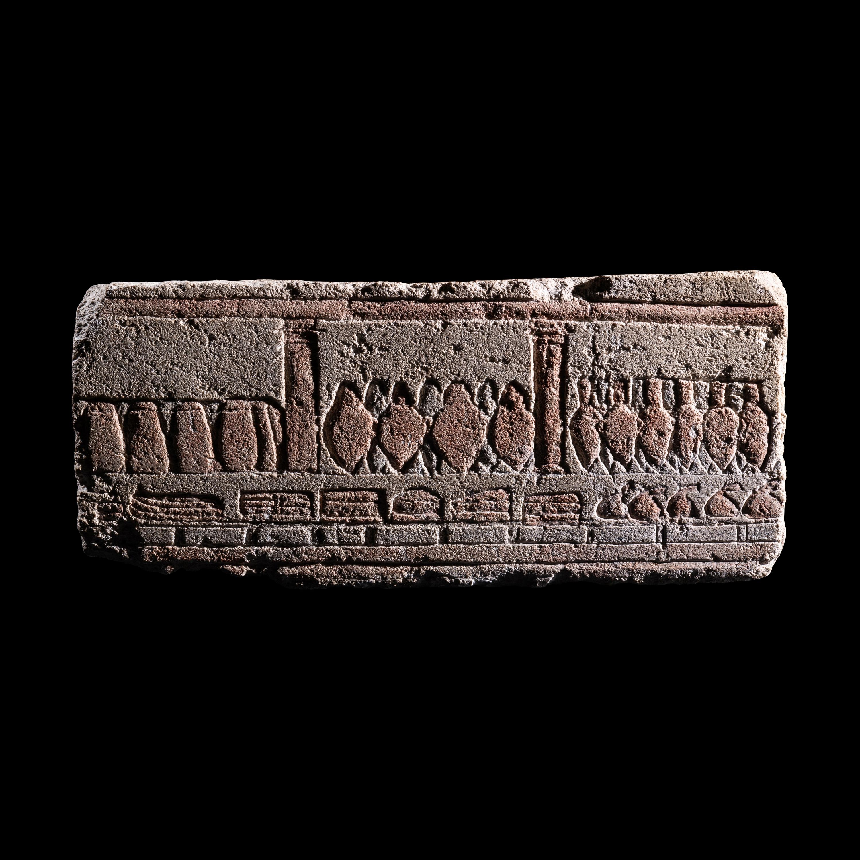 An Egyptian Polychrome Relief with Offering to the Aten