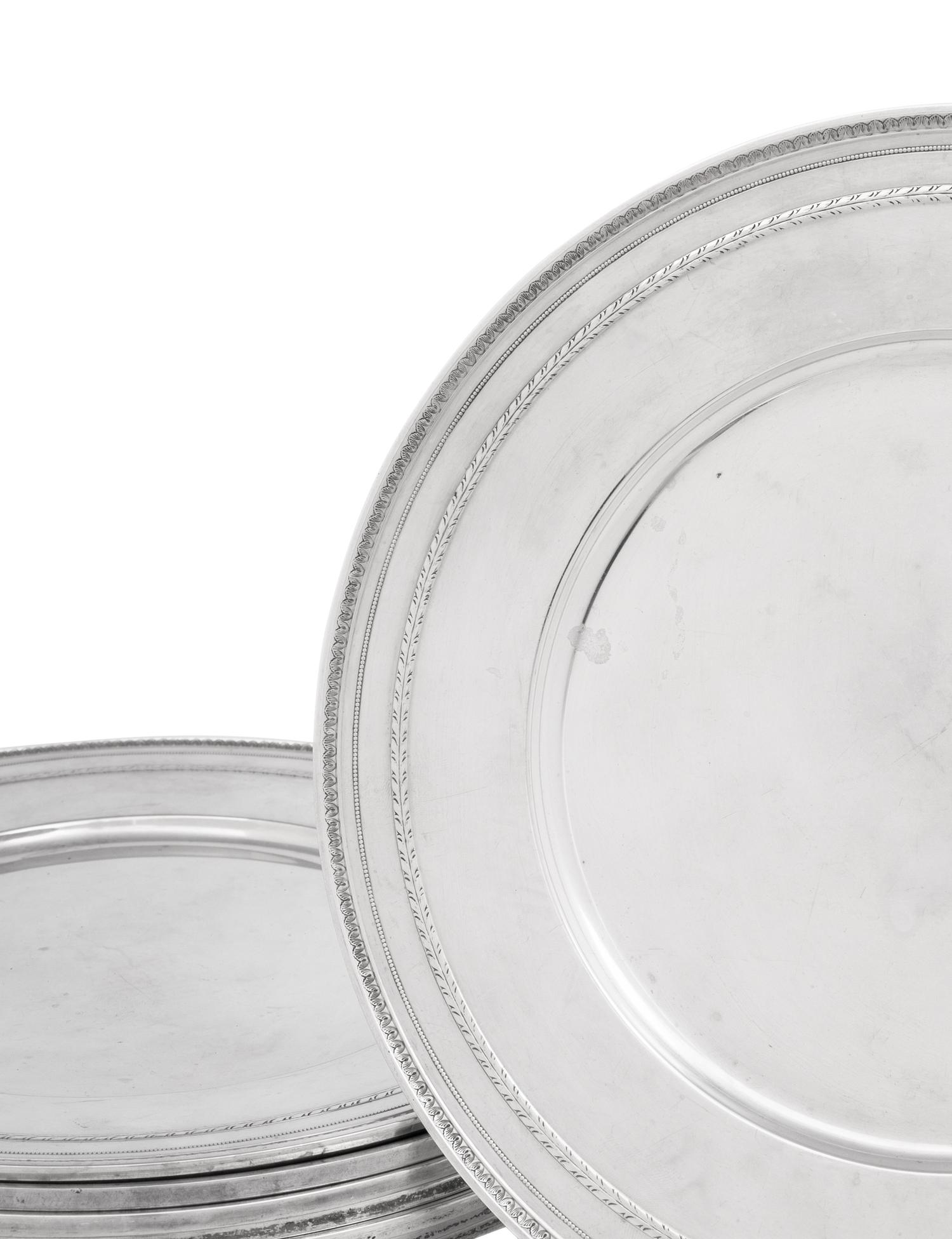A Set of Eight American Silver Chargers