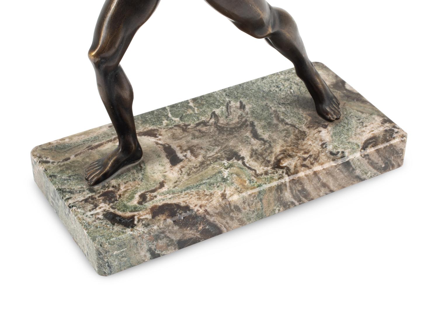 A Grand Tour Bronze Figure on a Marble Base