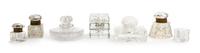 A Collection of Seven Cut Glass Paperweights, Width of widest 4 1/2 inches.