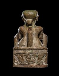An Egyptian Glazed Steatite Amulet of Pataikos on Crocodiles