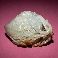 A Chinese Russet and Celadon Jade ‘Magpie and Plum Blossoms’ Peach-Form Coupe, 19th Century — 清晚期 青白玉帶皮喜上眉梢桃形杯