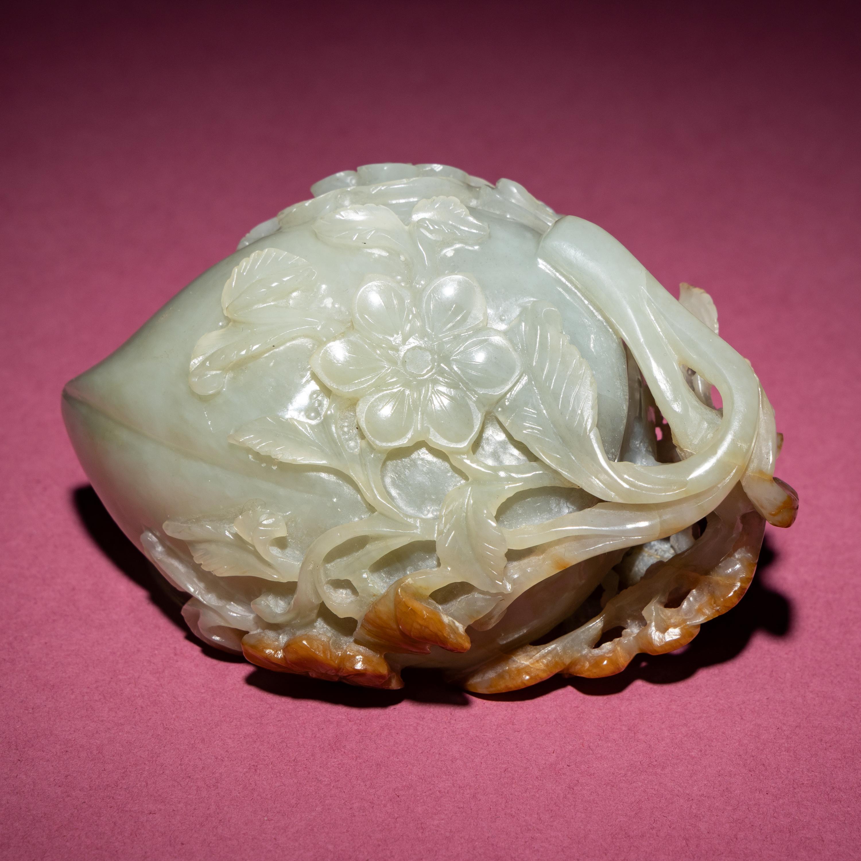 A Chinese Russet and Celadon Jade ‘Magpie and Plum Blossoms’ Peach-Form Coupe, 19th Century — 清晚期 青白玉帶皮喜上眉梢桃形杯
