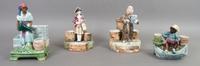 A Collection Four Figural Majolica Match Strikes, Height of tallest 8 3/4 inches.