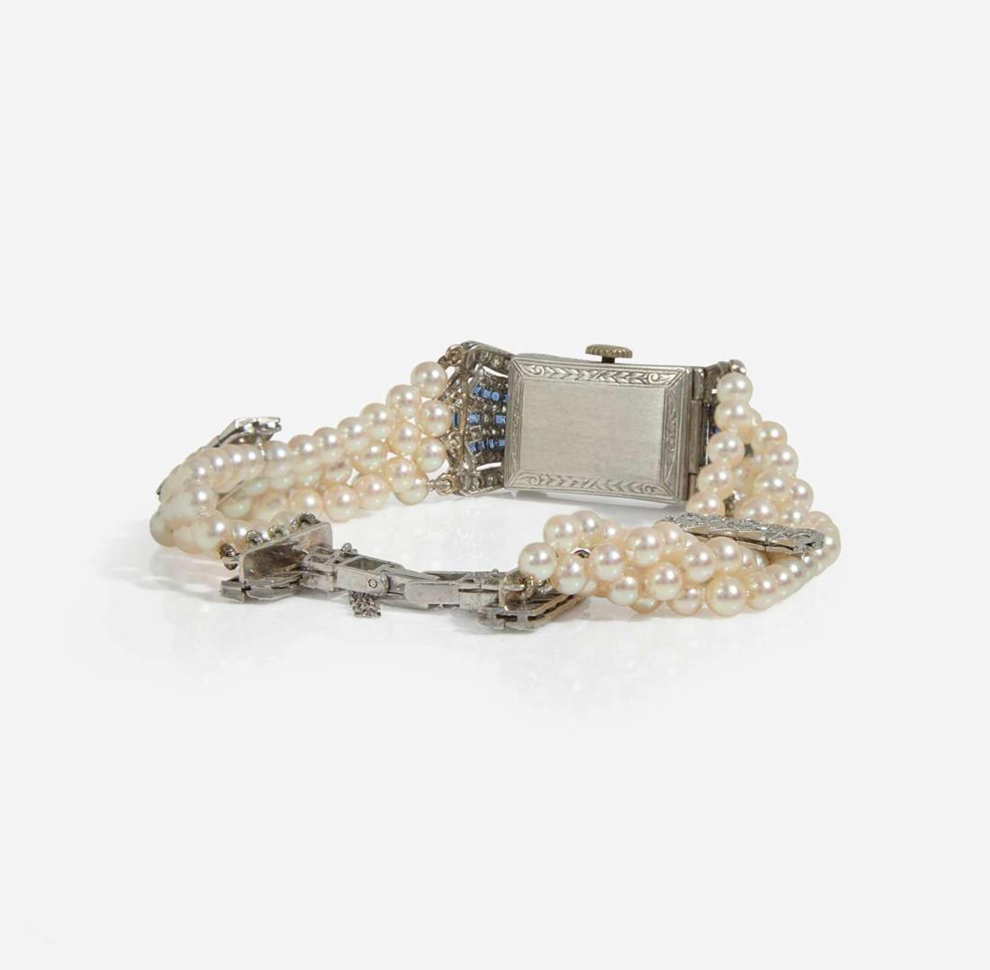 An Art Deco Pearl, Diamond, and Sapphire Watch