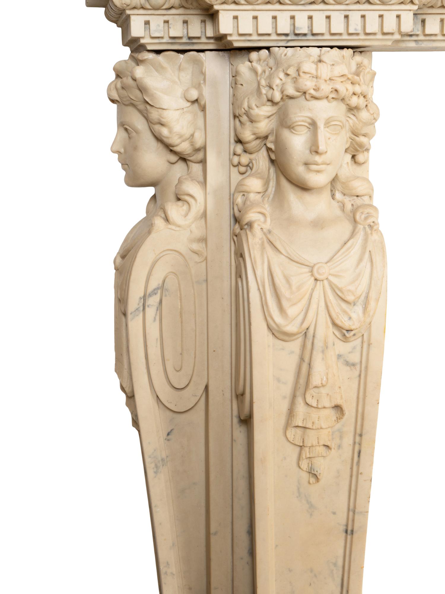 An Italian Renaissance Style Simulated Marble Fireplace Surround