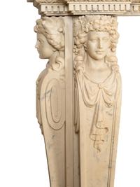 An Italian Renaissance Style Simulated Marble Fireplace Surround