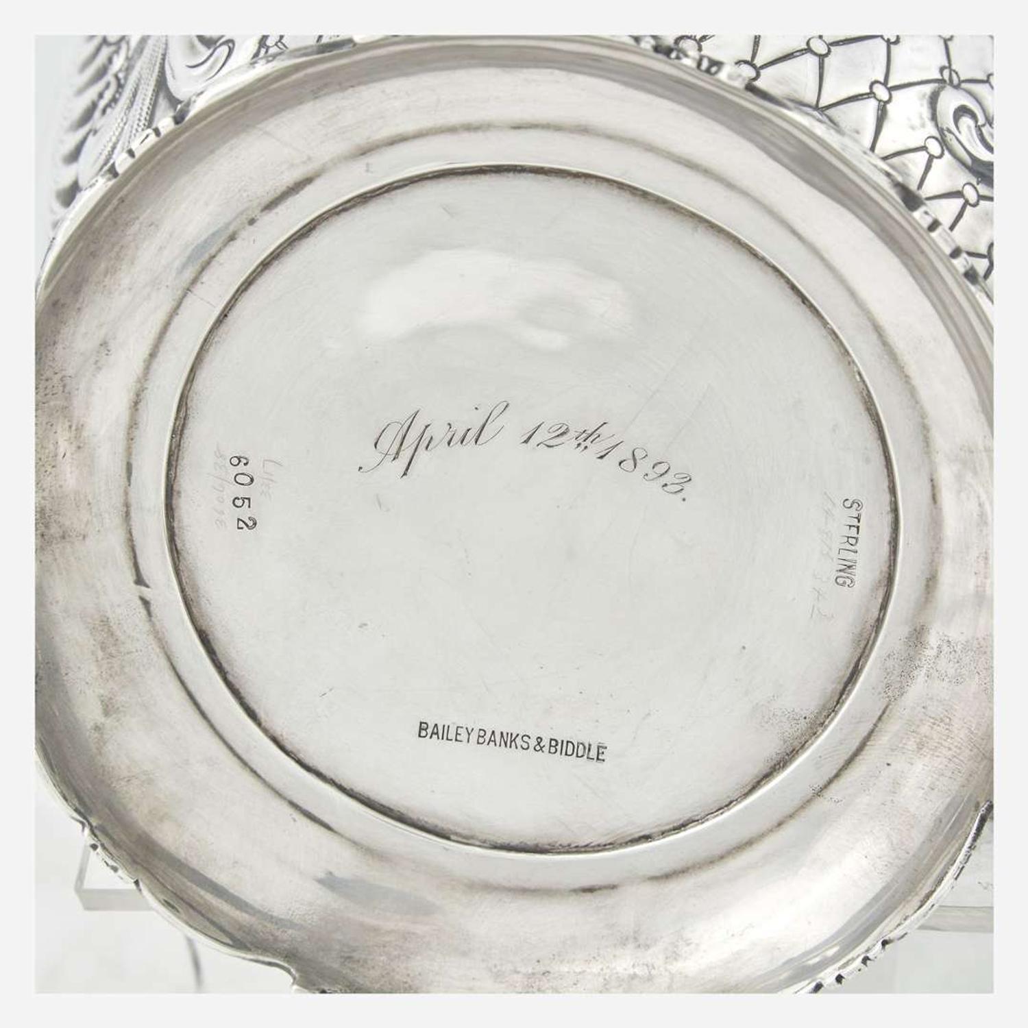 A sterling silver repoussé water pitcher Retailed by Bailey Banks & Biddle, Philadelphia, PA, late 19th century