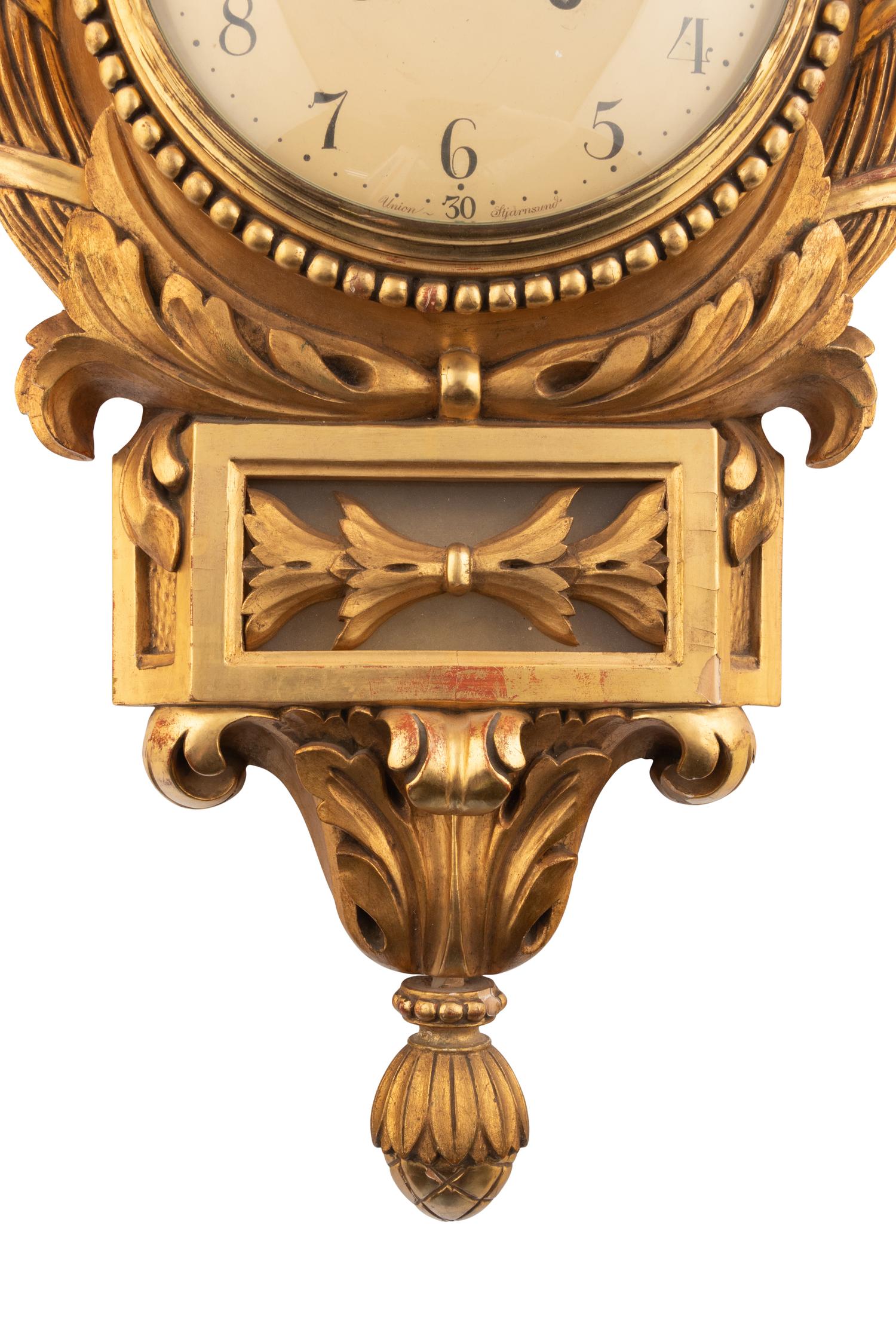 A Continental Giltwood Cartel Clock