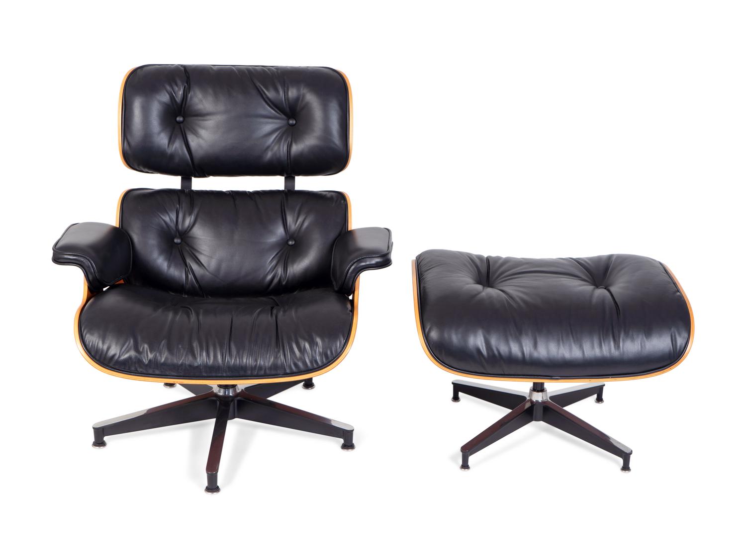 An Eames Laminated Walnut and Black Leather Lounge and Ottoman — FOR HERMAN MILLER