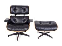 An Eames Laminated Walnut and Black Leather Lounge and Ottoman — FOR HERMAN MILLER