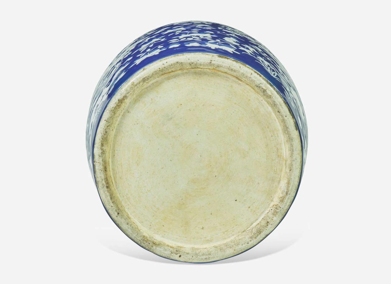 A very large Chinese blue ground white slip-decorated vase, mid 19th century 藍地白花貫耳瓶 十九世紀