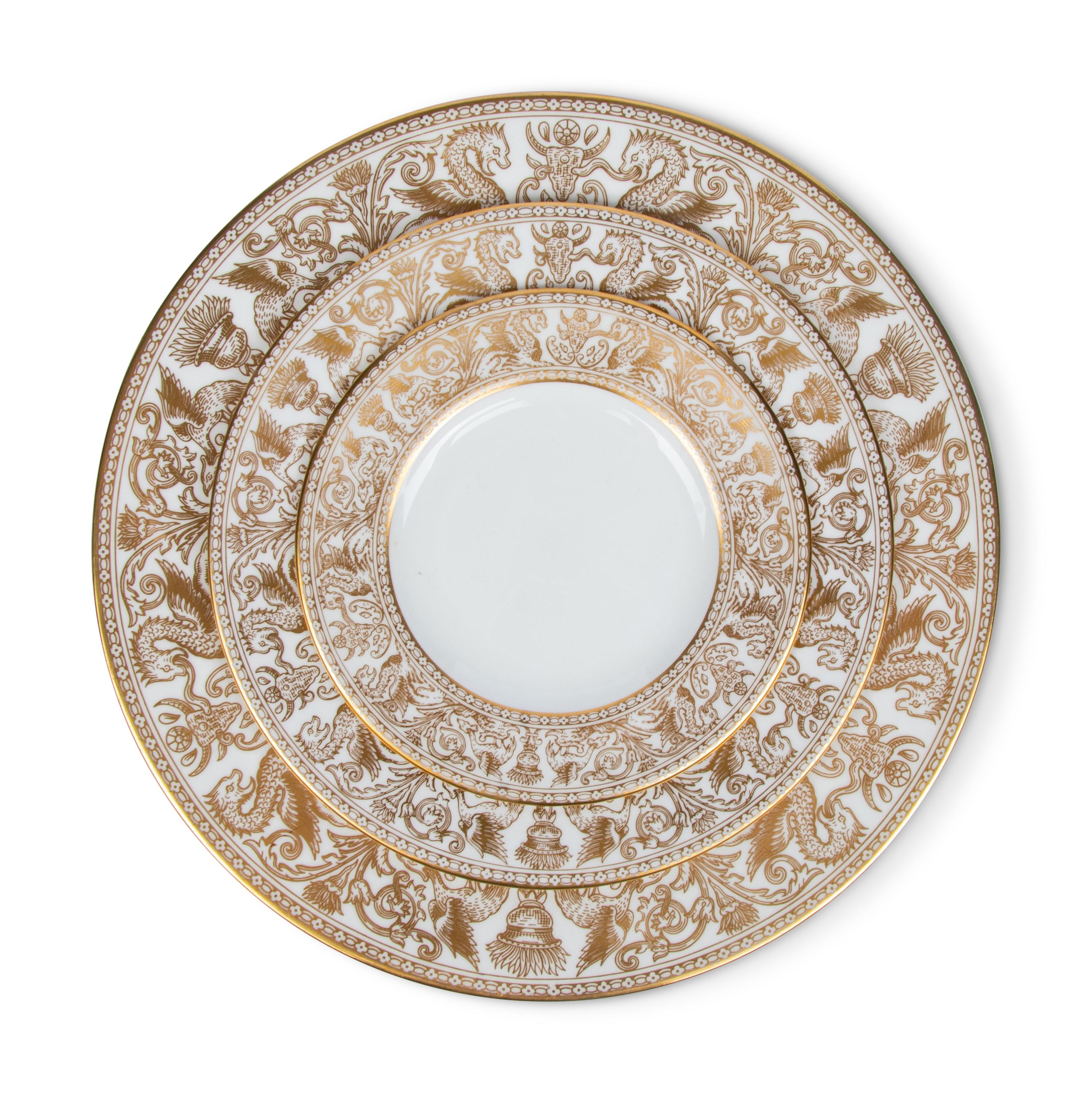 A Wedgwood Gold Florentine Porcelain Dinner Service