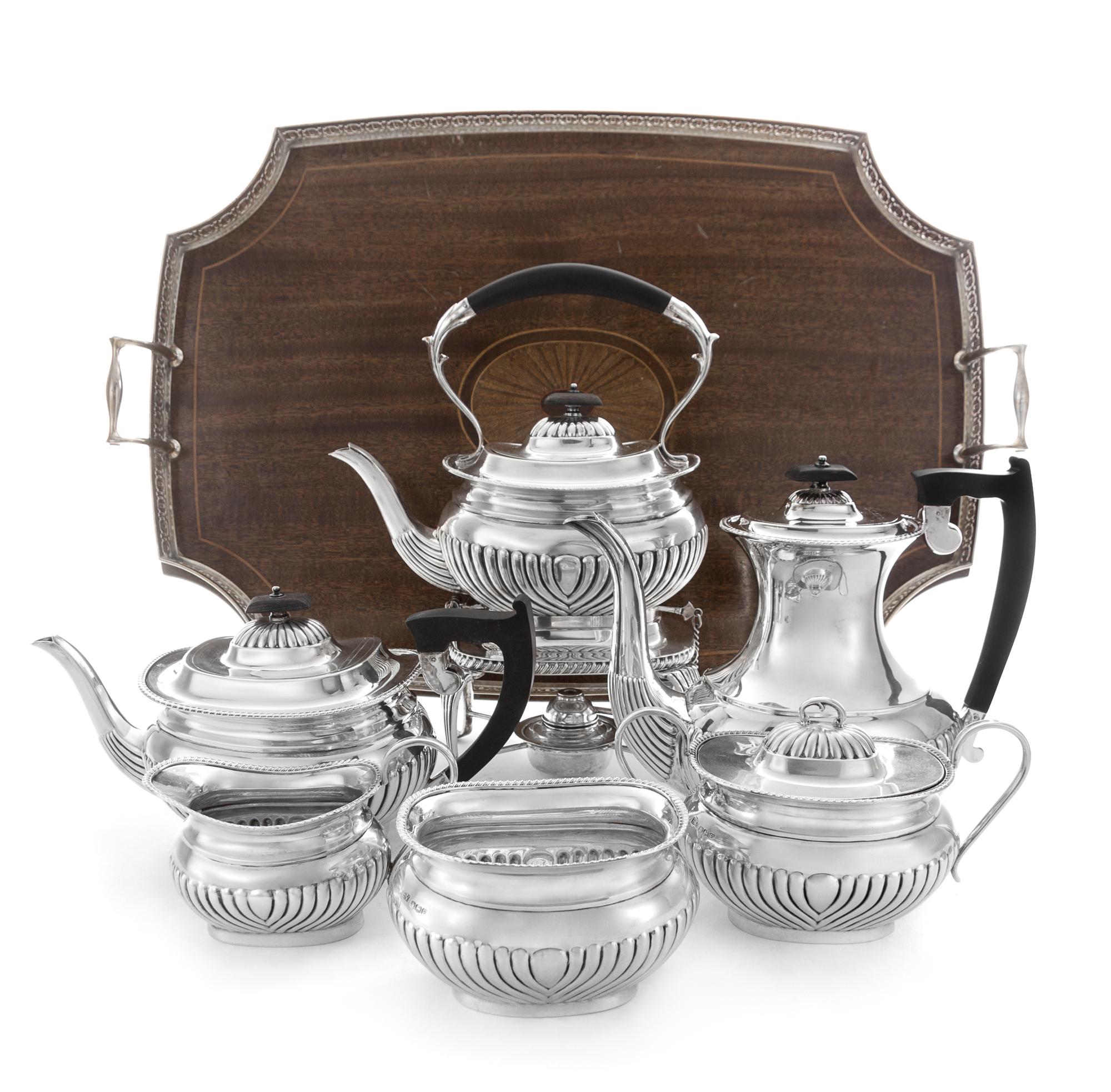 An English Silver Seven-Piece Tea and Coffee Service, Edward Viners Ltd., Sheffield, 1947, each having a demi-fluted body, comprising a