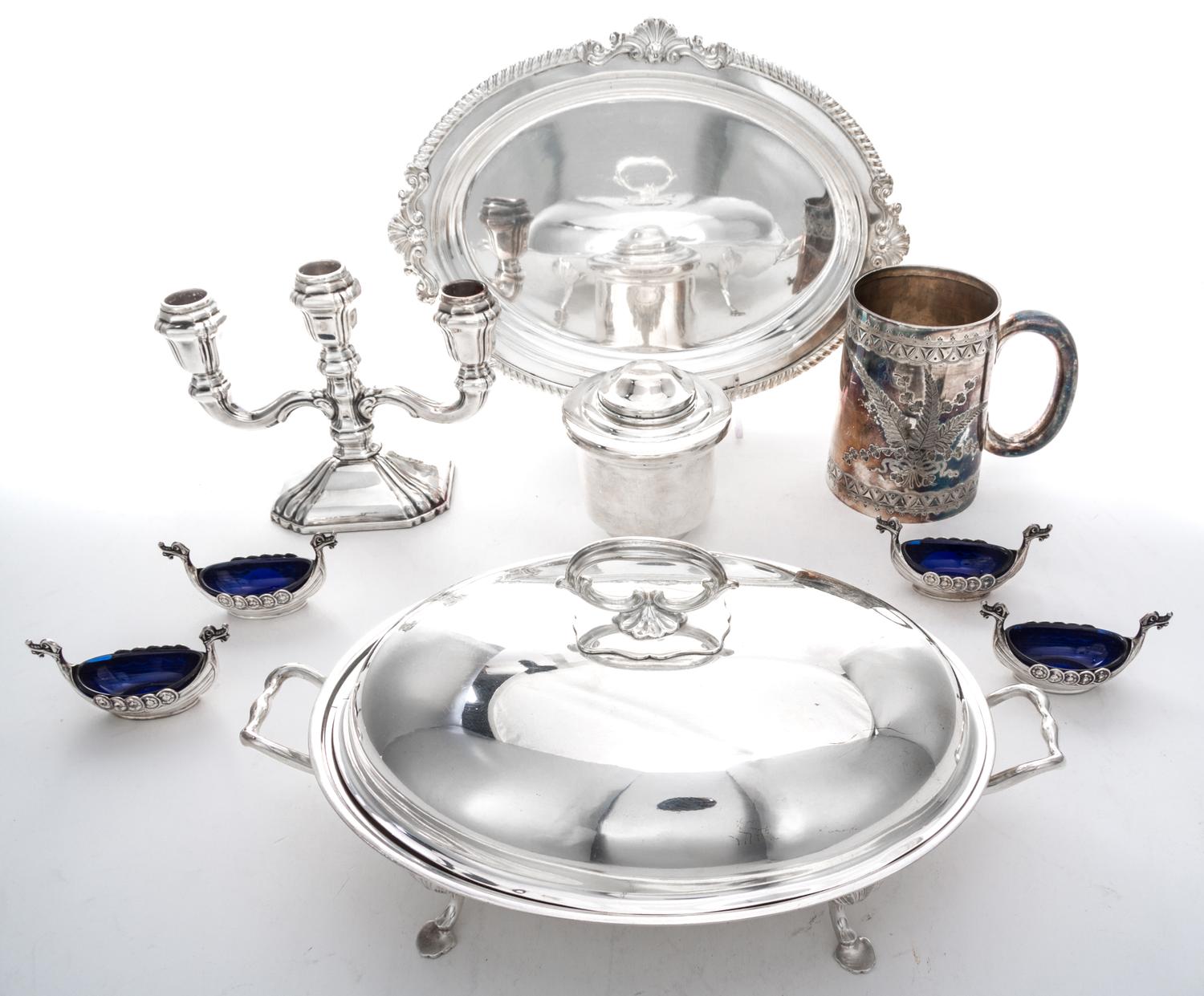 A Collection of Silver-plate Table Articles, , comprising four salts in the form of viking ships, a center bowl, a three-light candelab